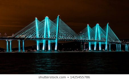 Mario Cuomo Bridge lit up blue at night